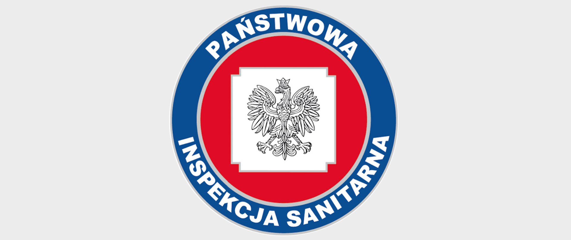 Logo Państwowej Inspekcji Sanitarnej na jasnoszarym tle. Znak ma formę okręgu w kolorach niebieskim i czerwonym, z białym napisem „Państwowa Inspekcja Sanitarna” oraz godłem Polski umieszczonym w centrum.
