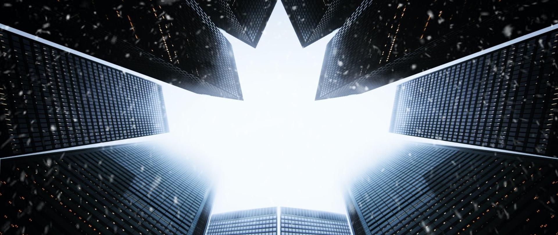 zdjęcie przedstawia symbolicznie liść klonu utworzony z nowoczesnych biurowców