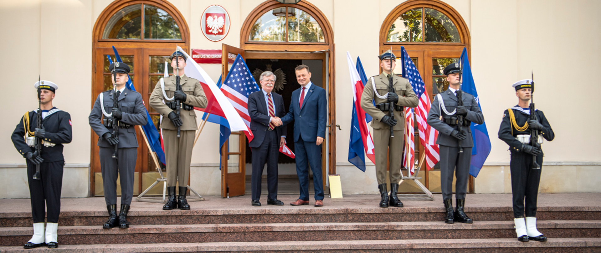 MinDef Blaszczak and Ambassador Bolton handshake