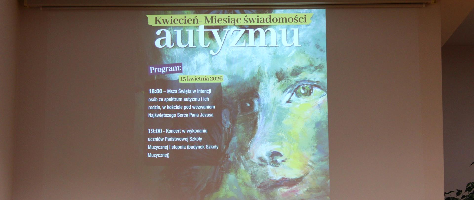 na sali koncertowej plakat wyświetlany z projektora, na którym widać kolorową grafikę przedstawiającą twarz, zbliżenie na oczy w artystycznym i malarskim stylu oraz pozostałe informacje dotyczące wydarzenia