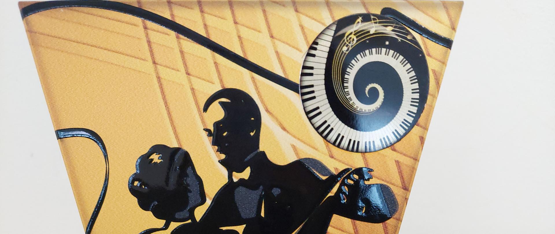 zdjęcie przedstawia tańczącą parę oraz logo w postaci zakręconej klawiatury i grafiki nut