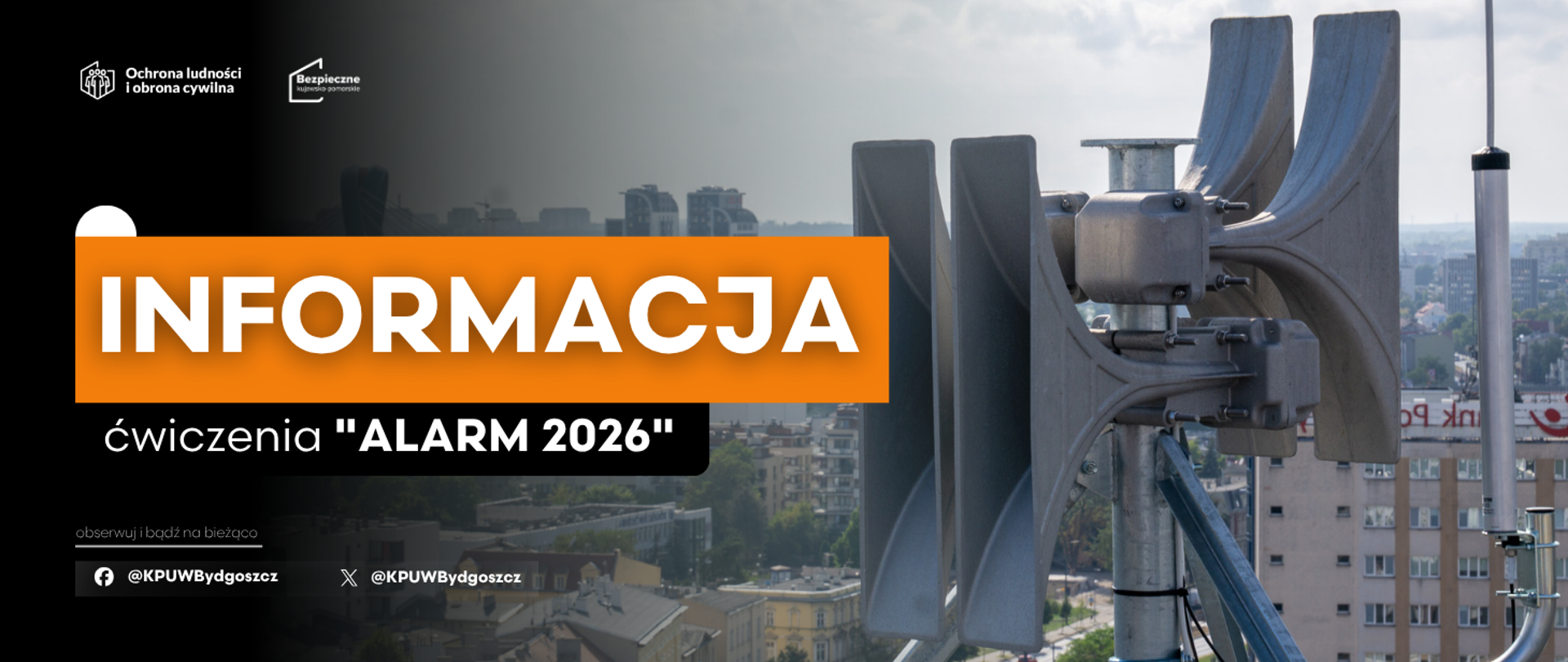 Na zdjęciu widać syrenę alarmową na tle zabudowy miasta. Na grafice znajduje się napis „INFORMACJA Ćwiczenia ALARM 2026” oraz logotypy „Ochrona ludności i obrona cywilna” i „Bezpieczne Kujawsko-Pomorskie”. W dolnej części umieszczono nazwy profili KPUW w mediach społecznościowych.