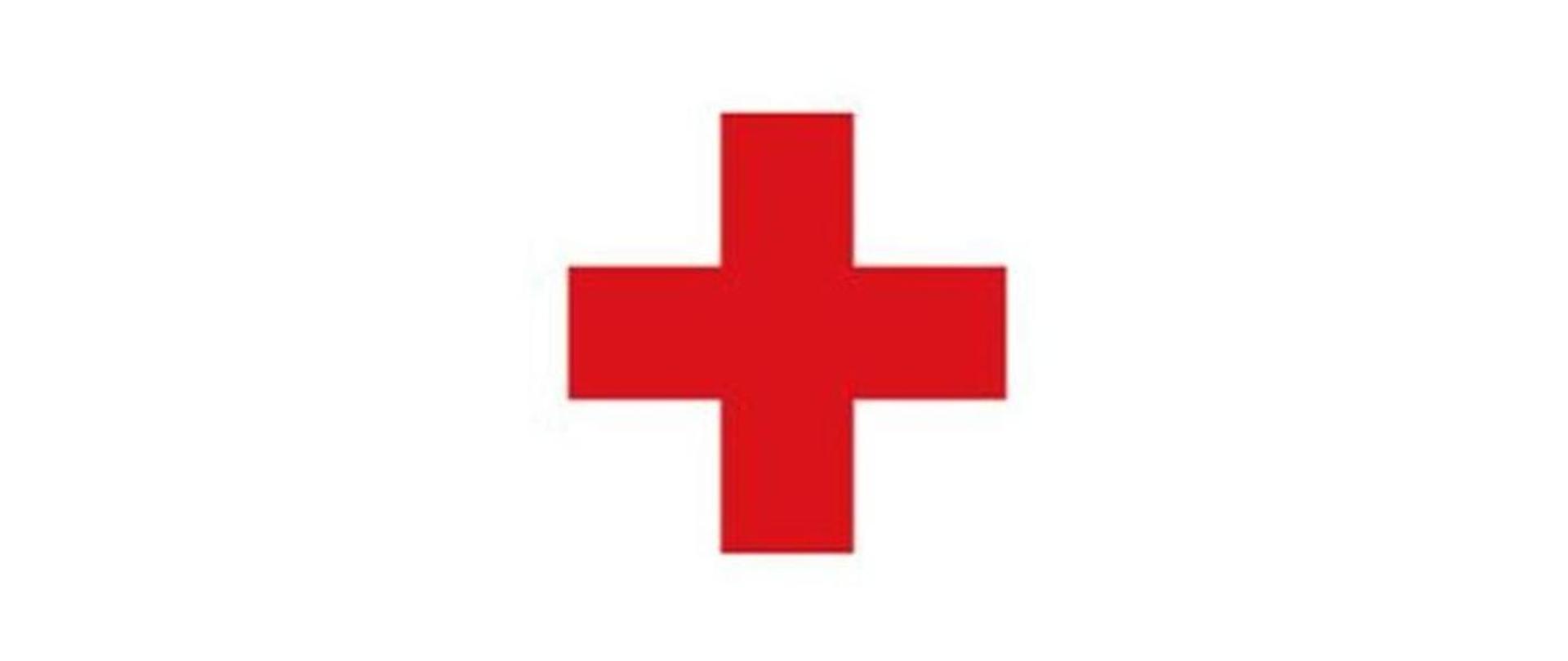 Na zdjęciu widać znak czerwonego krzyża. czerwony krzyż na białym tle
