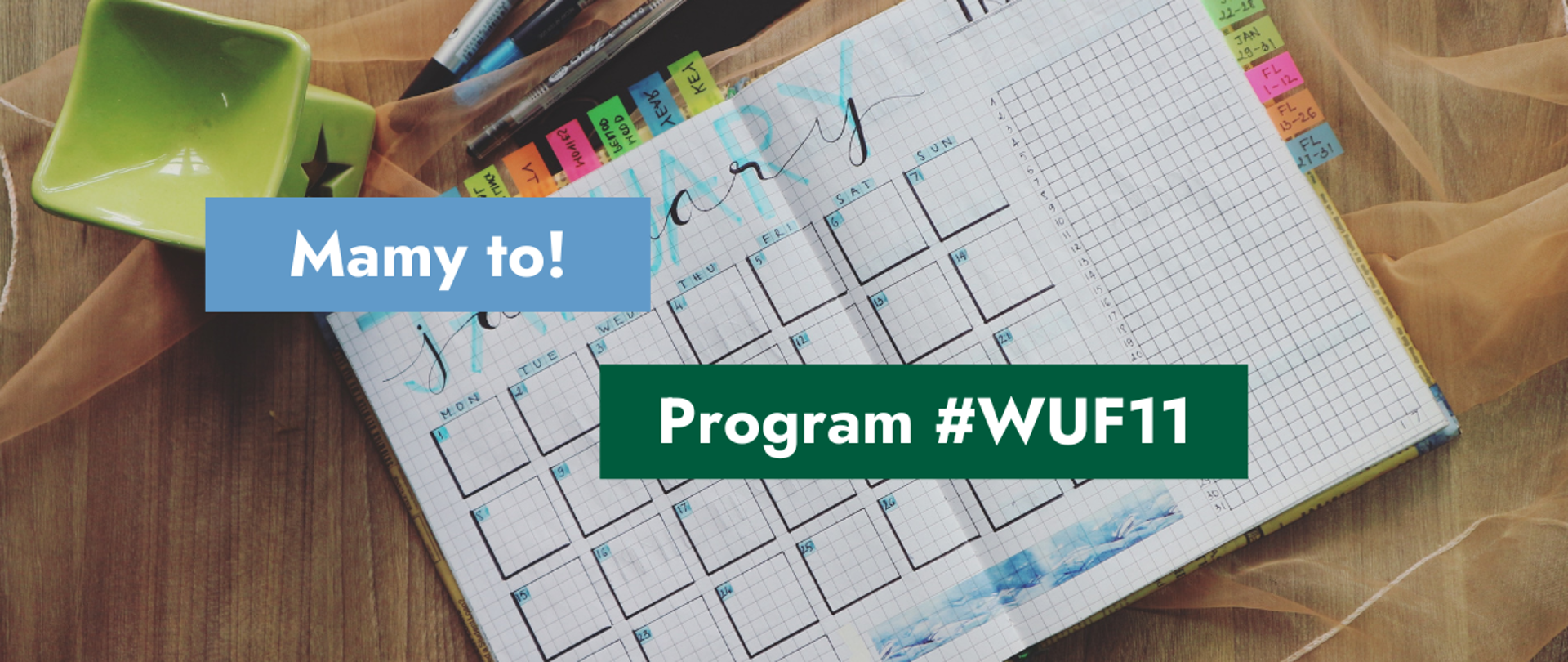 Na grafice zdjęcie rozłożonego terminarza leżącego na stole oraz tekst: Mamy to! Program #WUF11.