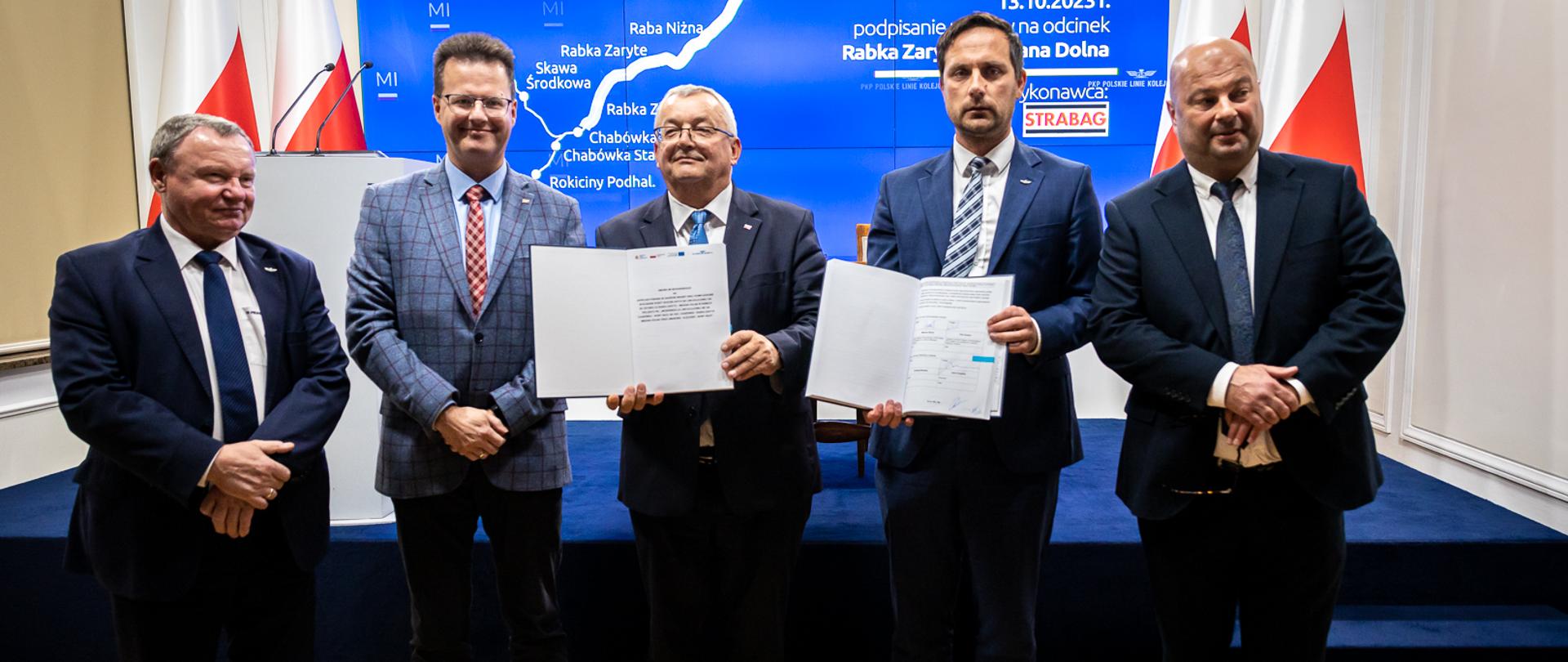 13 października 2023 r. PKP Polskie Linie Kolejowe SA podpisały umowę za prawie 430 mln zł na modernizację kolejnego odcinka linii kolejowej nr 104 Rabka Zaryte – Mszana Dolna w ramach projektu Podłęże – Piekiełko