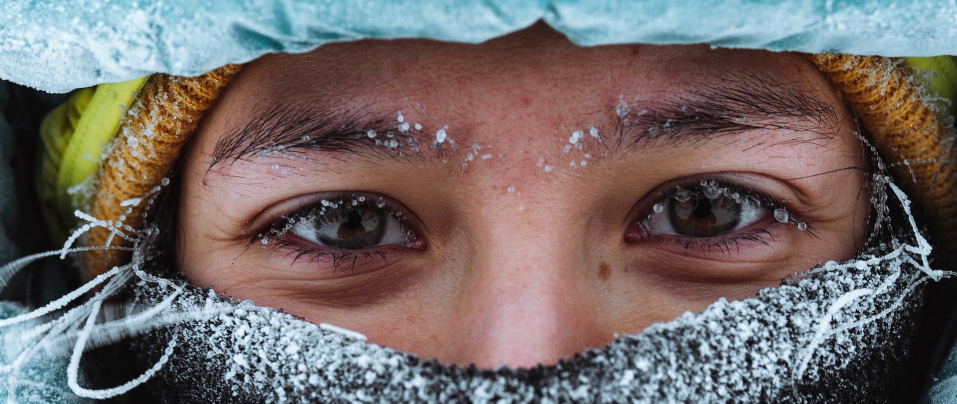 Closeup of a female mountaineer in wintertime at Glen Coe, Scotland