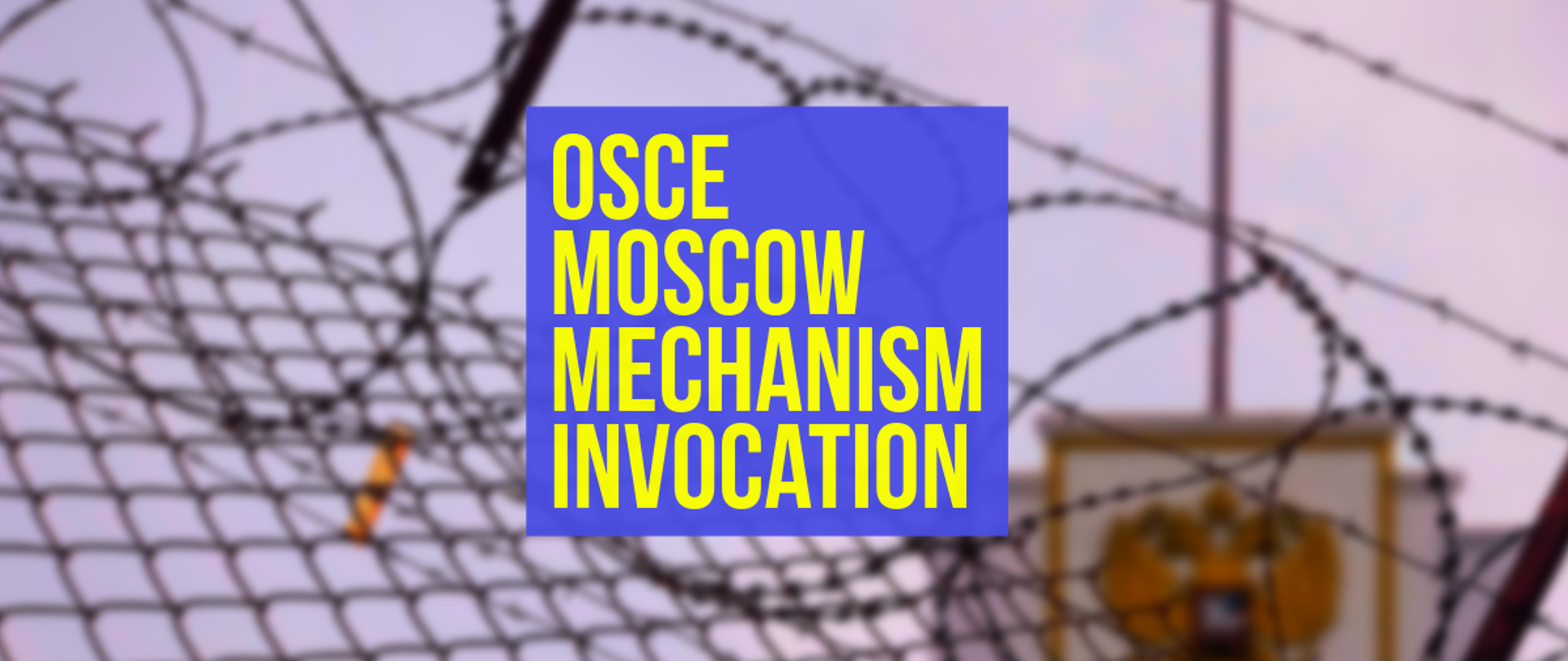 The photo depicts barbered wire with an inscription "OSCE Moscow Mechanism Invocation"