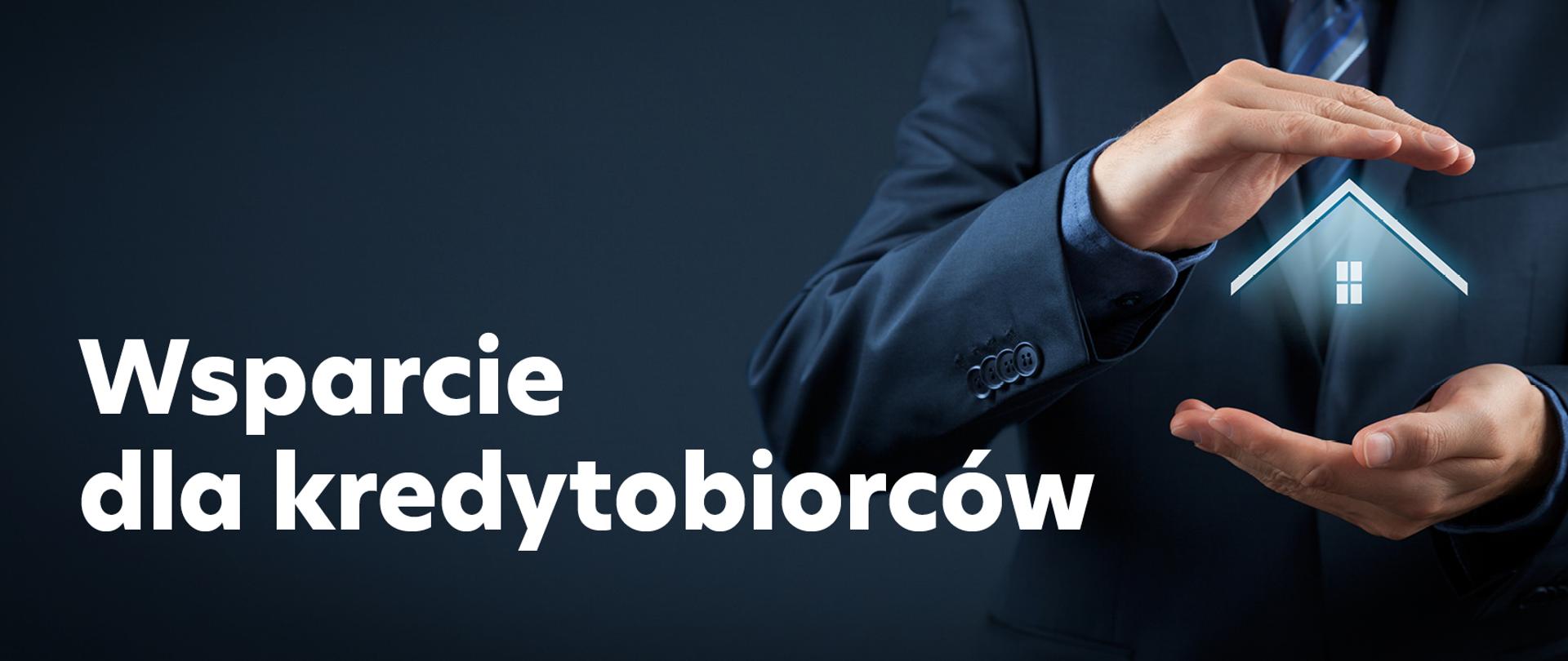 Dach domu pomiędzy dłońmi, napis Wsparcie dla kredytobiorców