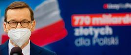 Premier na tle napisu 770 mld zł dla Polski.