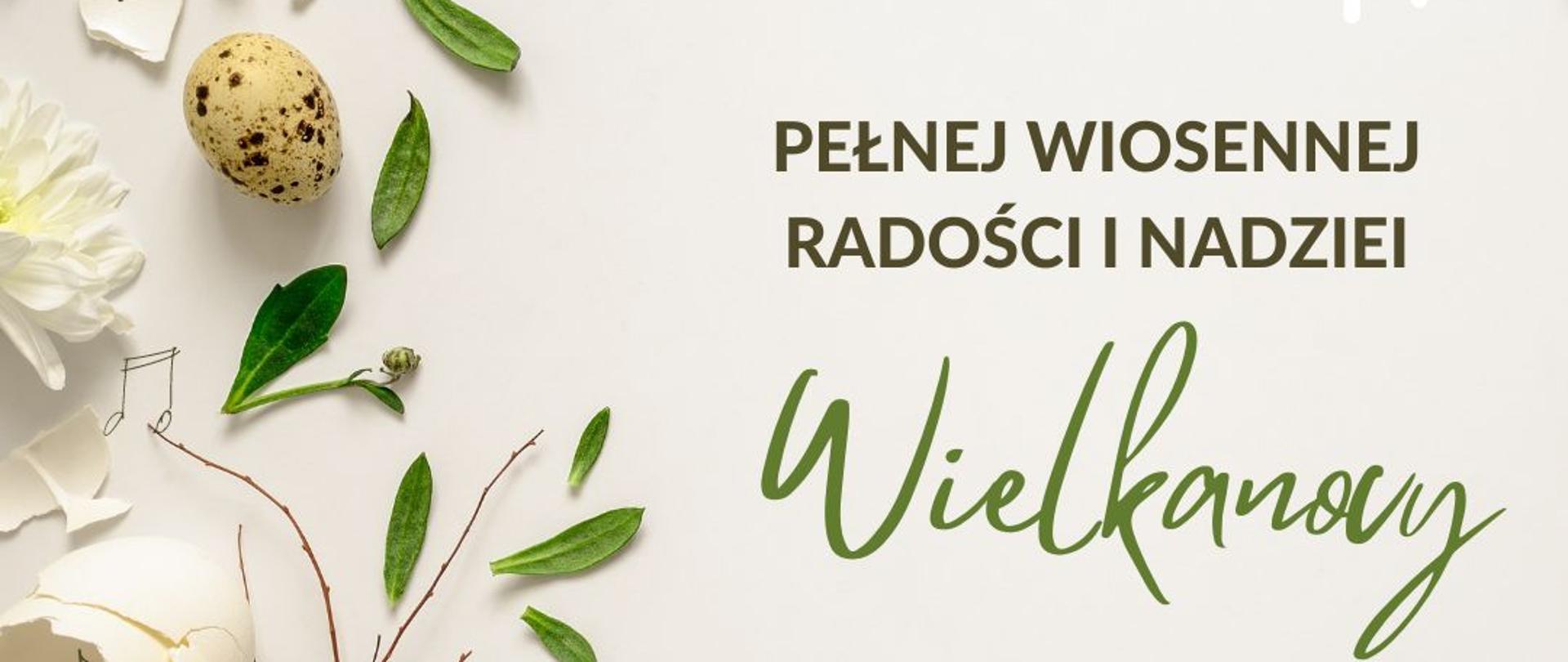 Na jasnym tle kwiatki, pisanki i nutki. U góry logo PSM w Jastrzębiu-Zdroju. Z prawej strony życzenia dla wszystkich sympatyków szkoły.