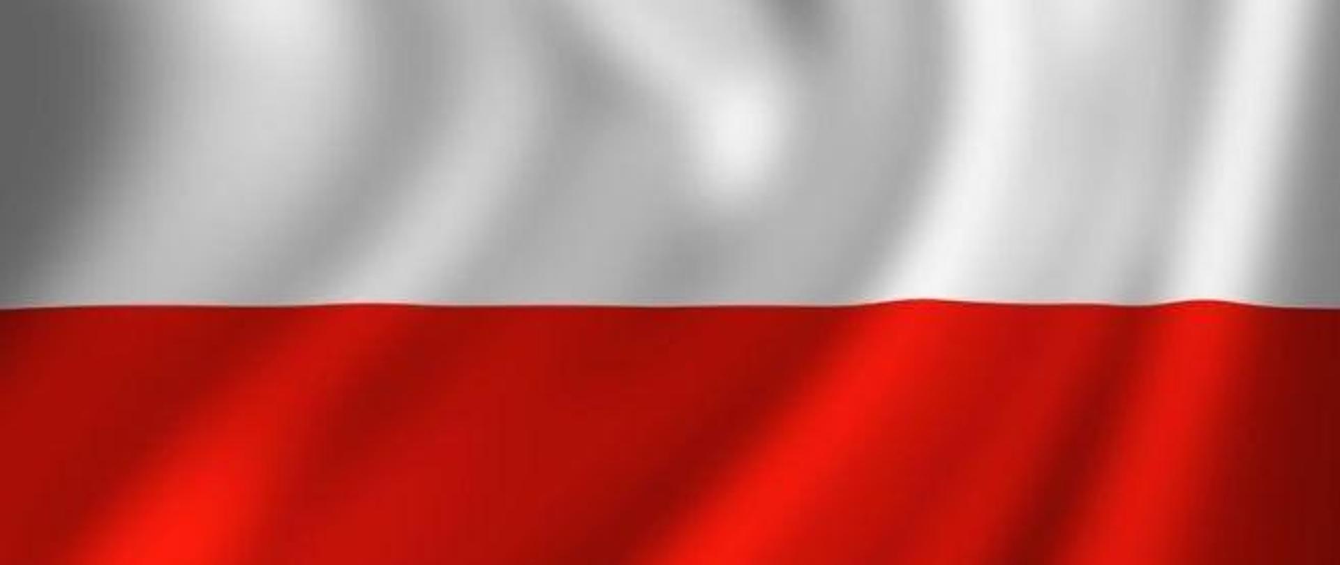 flaga biało - czerwona łopocąca na wietrze