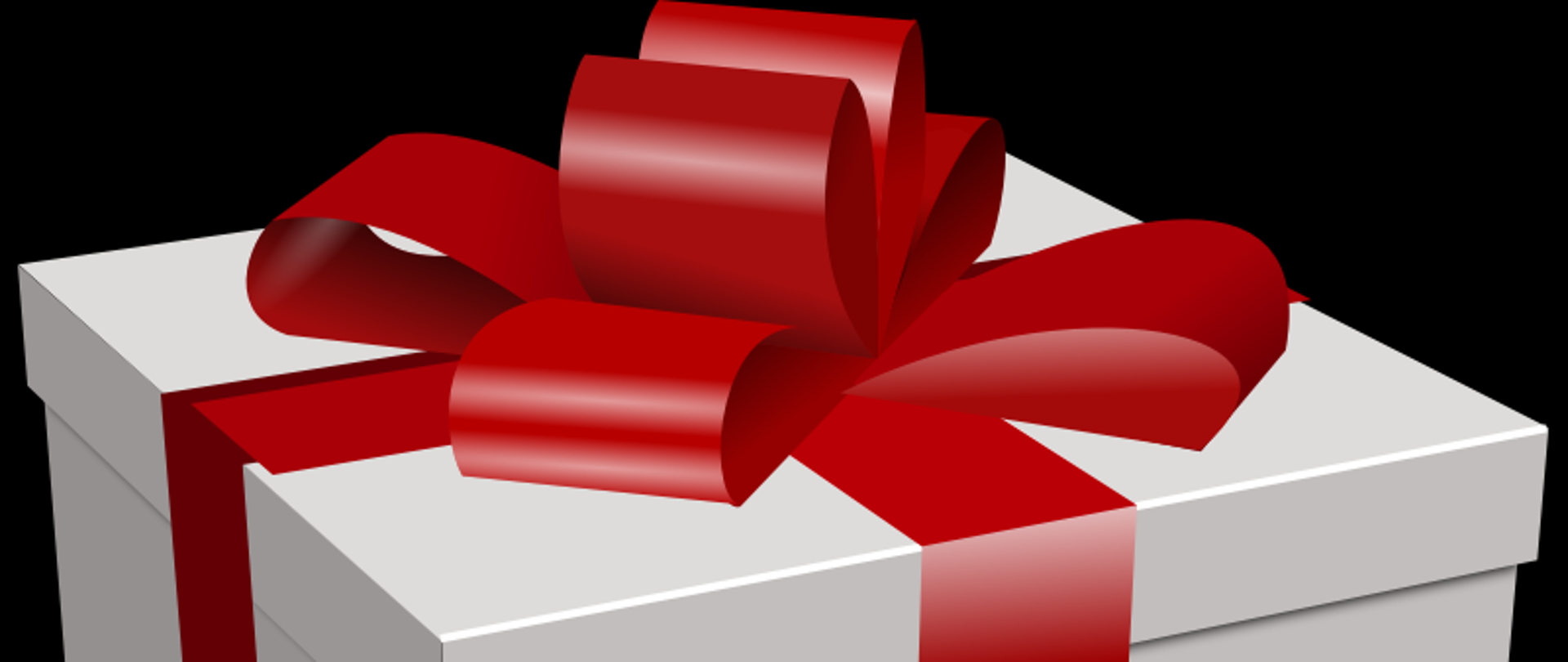 Zdjęcie przedstawia pudełko prezentowe obwiązane czerwoną wstążką.