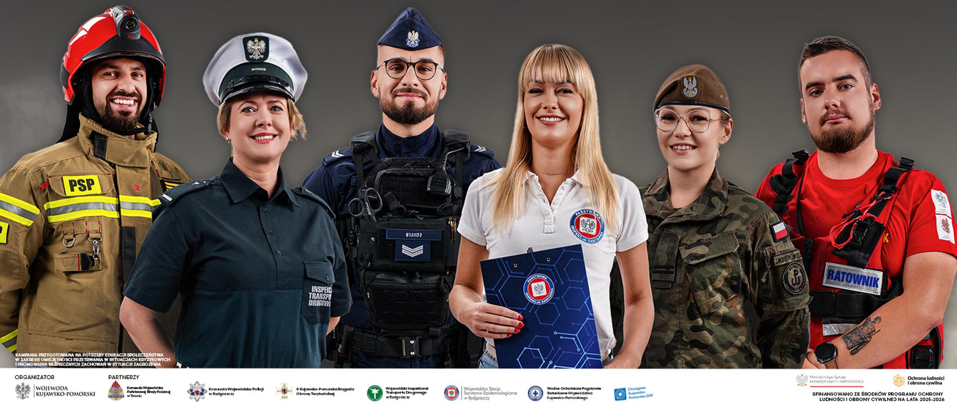 Na zdjęciu 6 osób, a każda reprezentuje służbę. od lewej strażak, inspektorka transportu drogowego, policjant, przedstawicielka służby sanitarnej, żołnierka i ratownik wodny. Wszyscy z uśmiechem.