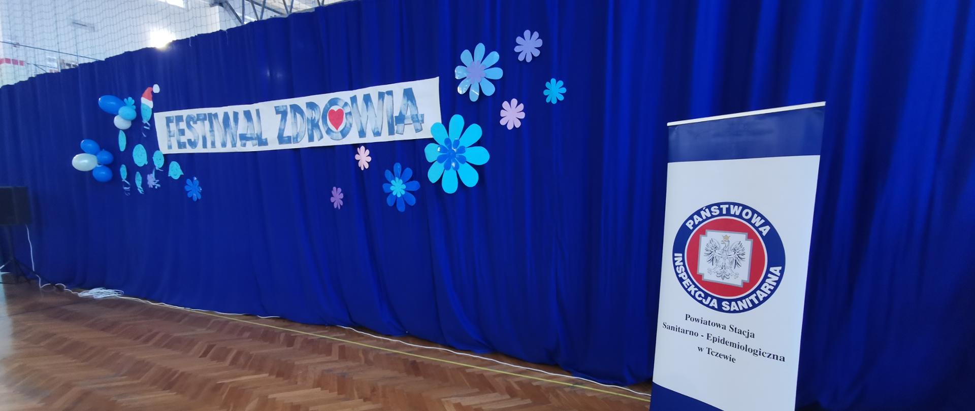 Festiwal Zdrowia- zdjęcie napisu w szkole i baner PSSE w Tczewie