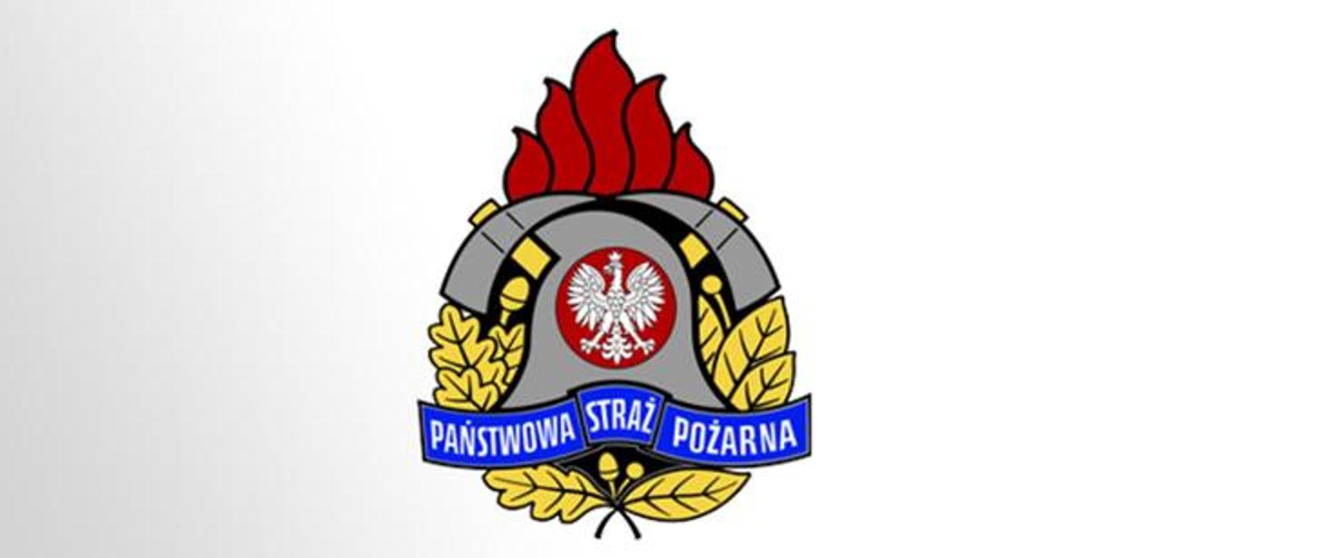 Slider - logotyp PSP, w centrum znajduje się godło Państwa Polskiego - Orzeł Biały. Hełm strażacki, który okalają dwa toporki. Całość dopełnia złoty wieniec z liści oraz owoców dębu i wawrzynu.