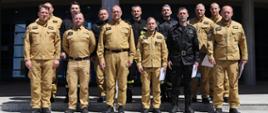 Grupowe zdjęcie uczestników warsztatów (11 funkcjonariuszy PSP) w towarzystwie Zastępcy Komendanta CS PSP oraz Naczelnika Wydziału Nauczania CS PSP