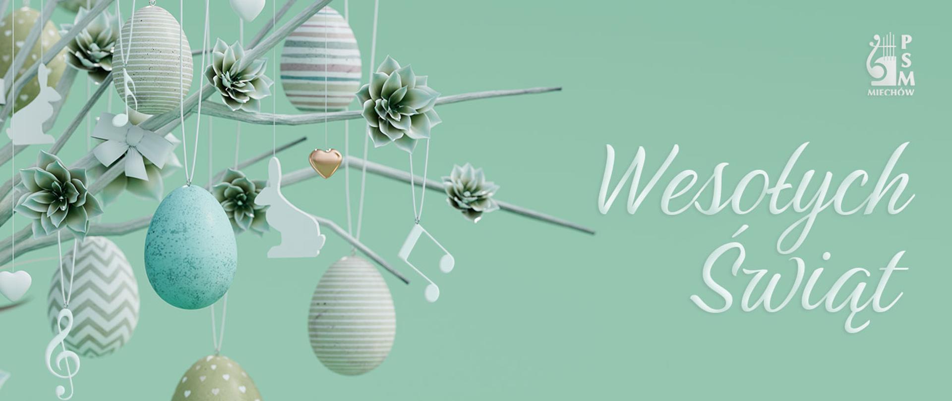 Pastelowa wielkanocna grafika z zawieszonymi pisankami, gałązkami i elementami muzycznymi (nuty, klucz wiolinowy) oraz napisem „Wesołych Świąt” i logo PSM w Miechowie.