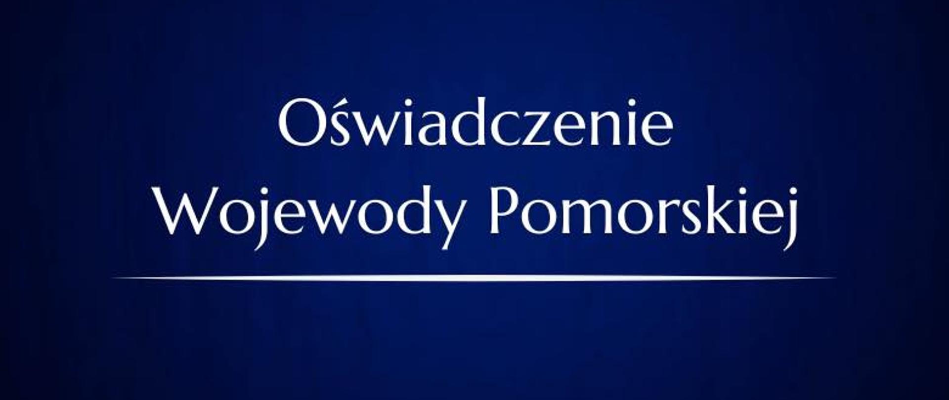 granatowa tablica z napisem Oświadczenie Wojewody Pomorskiej