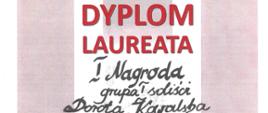 Dyplom Konkursu Gitarowego GITARIADA . Tło : różowo-białe pasy pionowe, na tle czerwony napis: XXV Jubileuszowy Ogólnopolski Konkurs Gitarowy Gitariada Dyplom Laureata. Napisy odręczne czarne:I nagroda gupa I soliści imię i nazwisko 