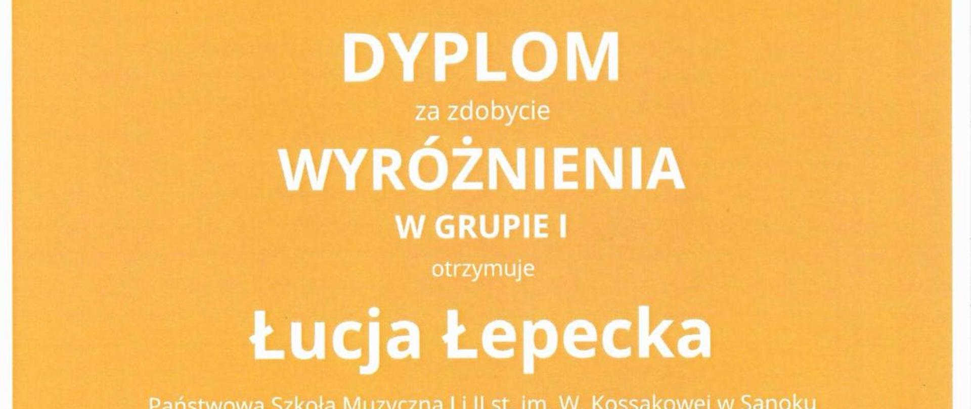 Dyplom wyróżnienie dla uczennicy Łucji Łepeckiej. Białe litery na pomarańczowym tle, na dole kolorowe nutki
