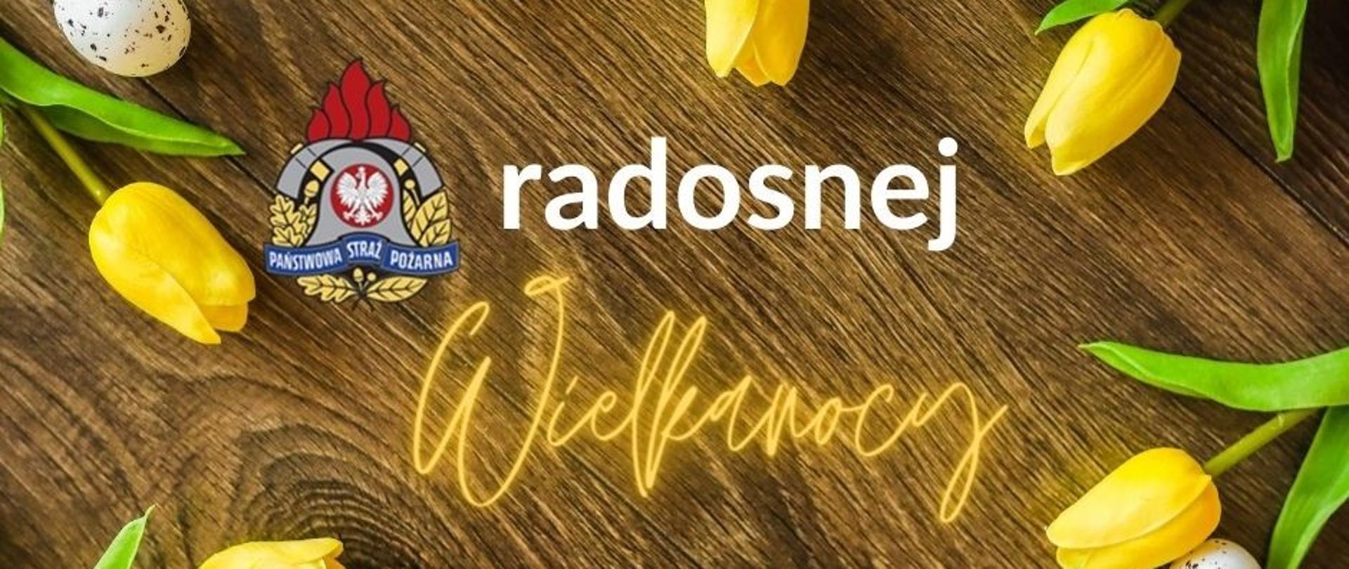 Baner głoszący "Radosnej Wielkanocy". Z prawej strony napisów umiejscowione jest logo PSP.
