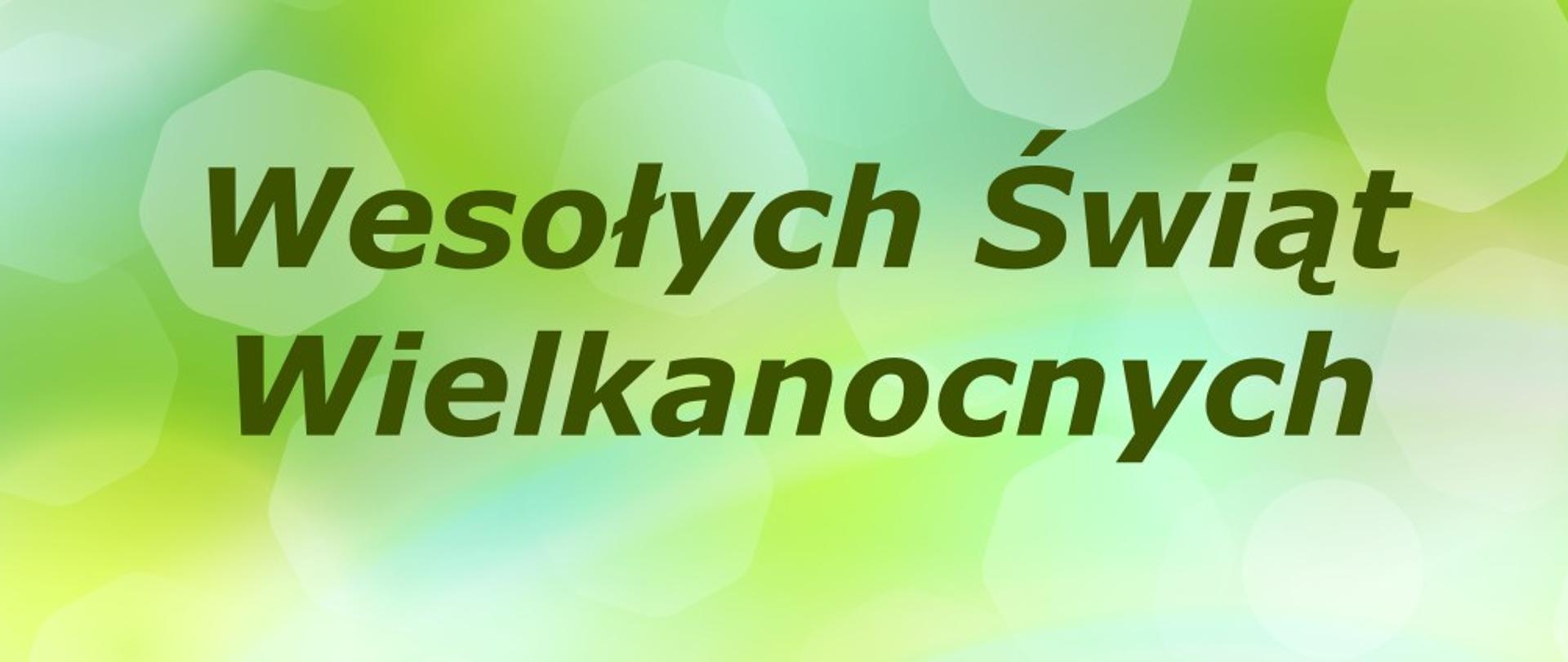 Na grafice na zielonym tle napis Wesołych Świąt Wielkanocnych