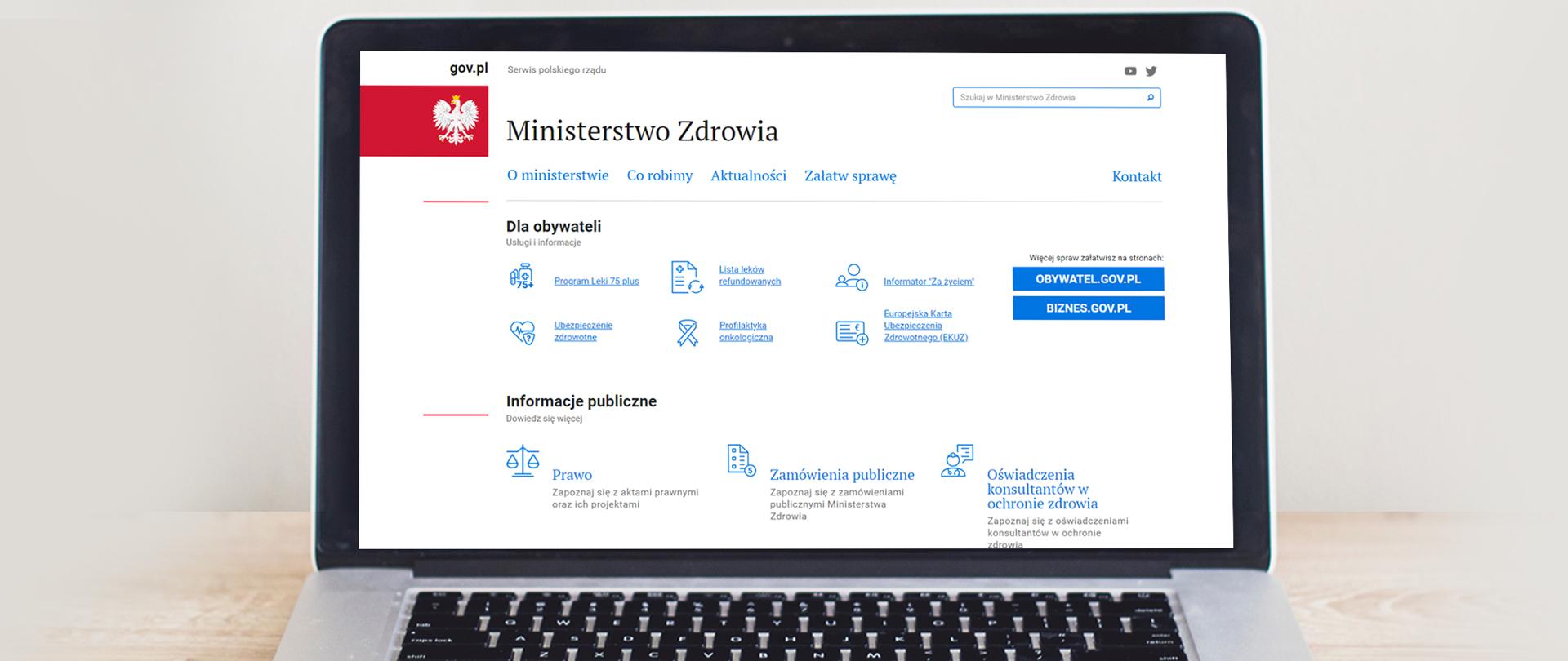 Grafika przedstawiająca otwartego laptopa, na którego ekranie wyświetla się strona główna Ministerstwa Zdrowia na portalu GOV.PL.