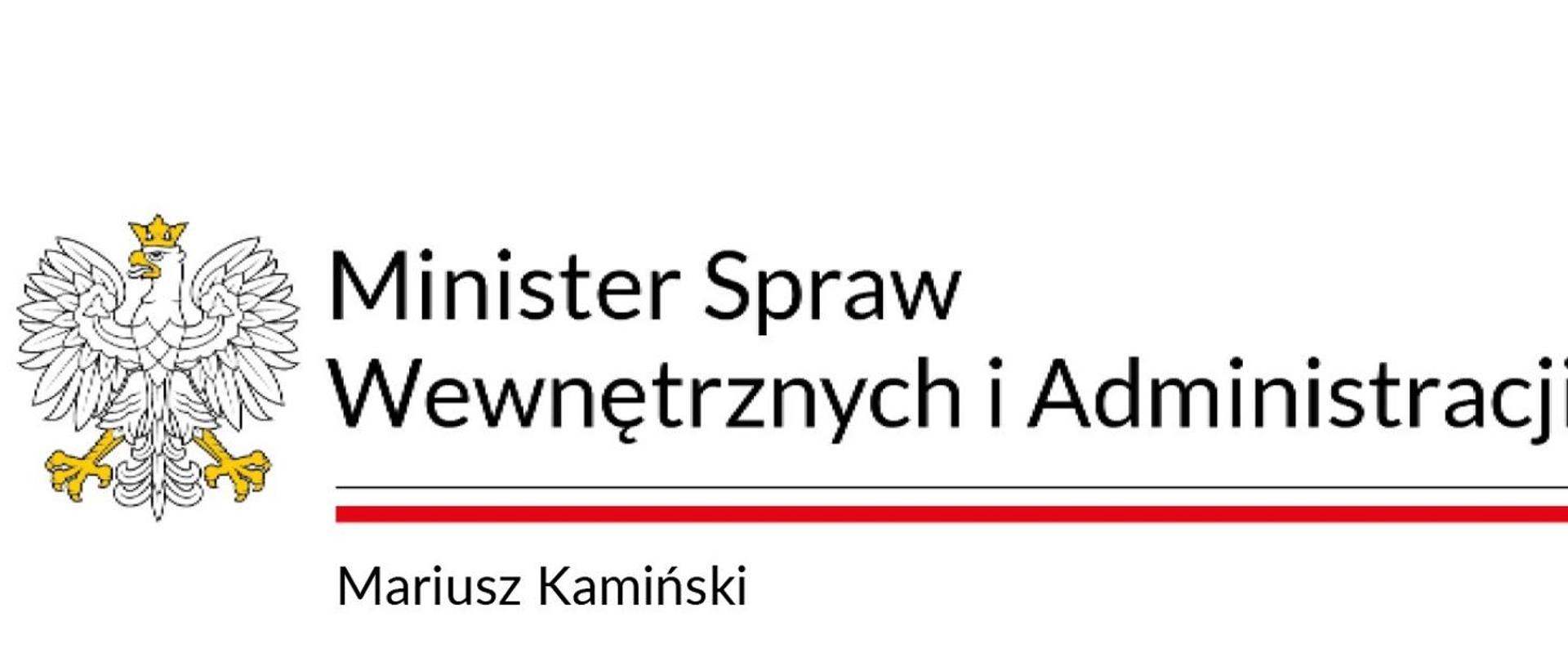 Orzeł w koronie i napis Minister Spraw Wewnętrznych i Administracji. Poniżej flaga państwowowa, a pod nią napis Mariusz Kamiński