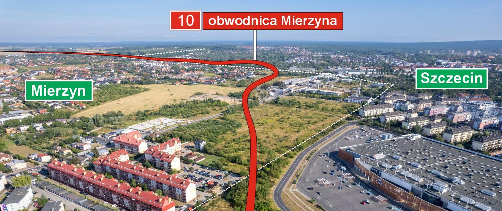 Zdjęcie pokazuje początek planowanej obwodnicy Mierzyna w ciągu drogi krajowej 10, zaznaczonej czerwonym przebiegiem na tle miejskiej zabudowy. Po lewej stronie widoczny jest Mierzyn, a po prawej Szczecin wraz z dużym kompleksem handlowym.