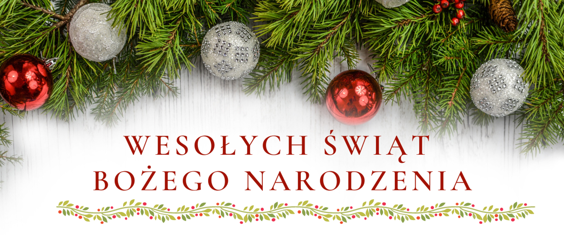 Plakat na białym tle, góra i dół plakatu wypełnione gałązkami świerku ozdobionego bombkami, na środku życzenia świąteczne.