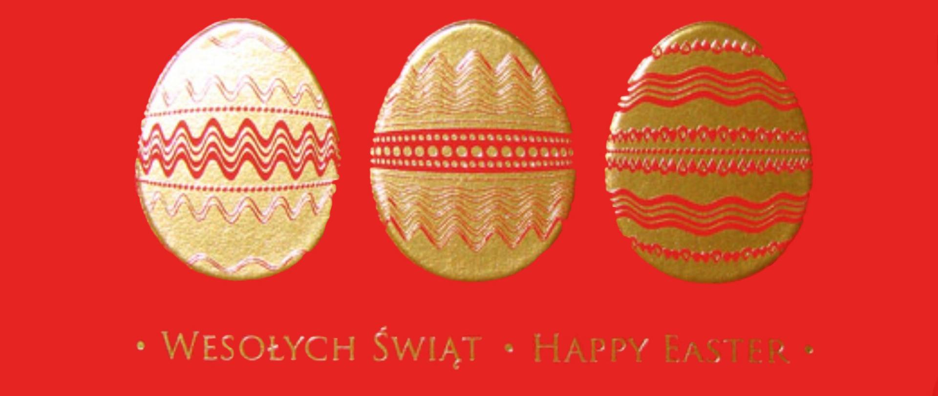 na czerwonym tle trzy złote pisanki i napisy wesołych świat oraz happy easter