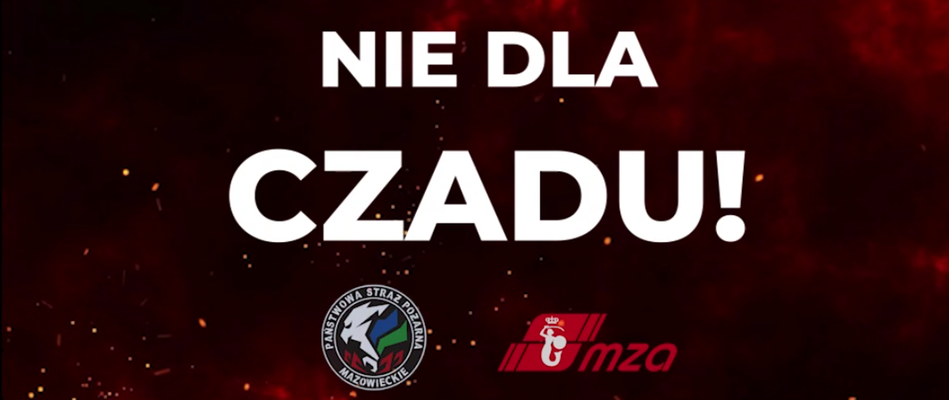 Fragment spotu. Czerwone ogniste tło. Na środku biały napis"NIE DLA CZADU!". Poniżej logo KW PSP w Warszawie oraz logo MZA.