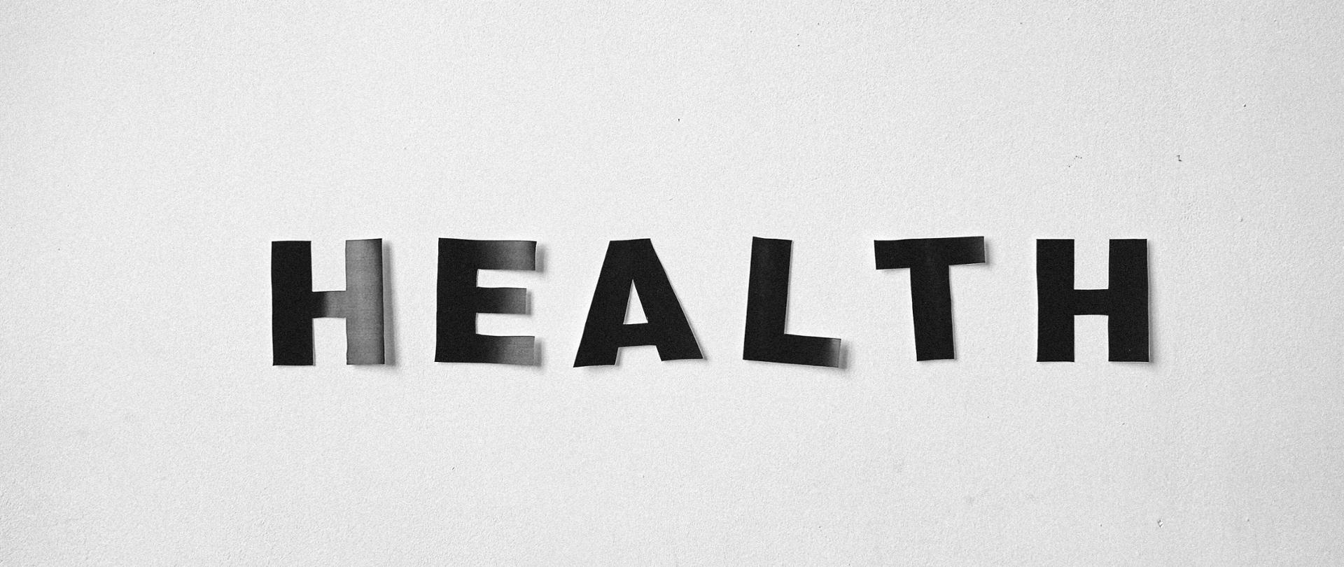 Na szarym tle grafiki widnieje napis Health - Zdrowie