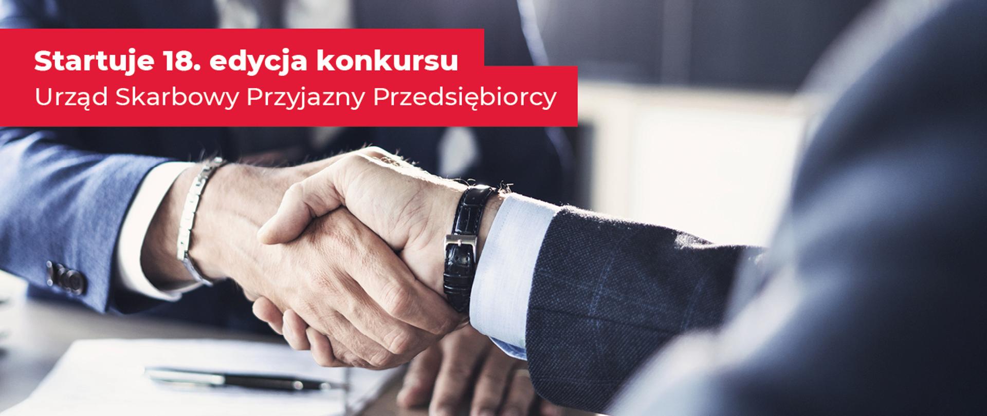 Uścisk dłoni i napis na czerwonym tle: Startuje osiemnasta edycja konkursu Urząd Skarbowy Przyjazny Przedsiębiorcy.