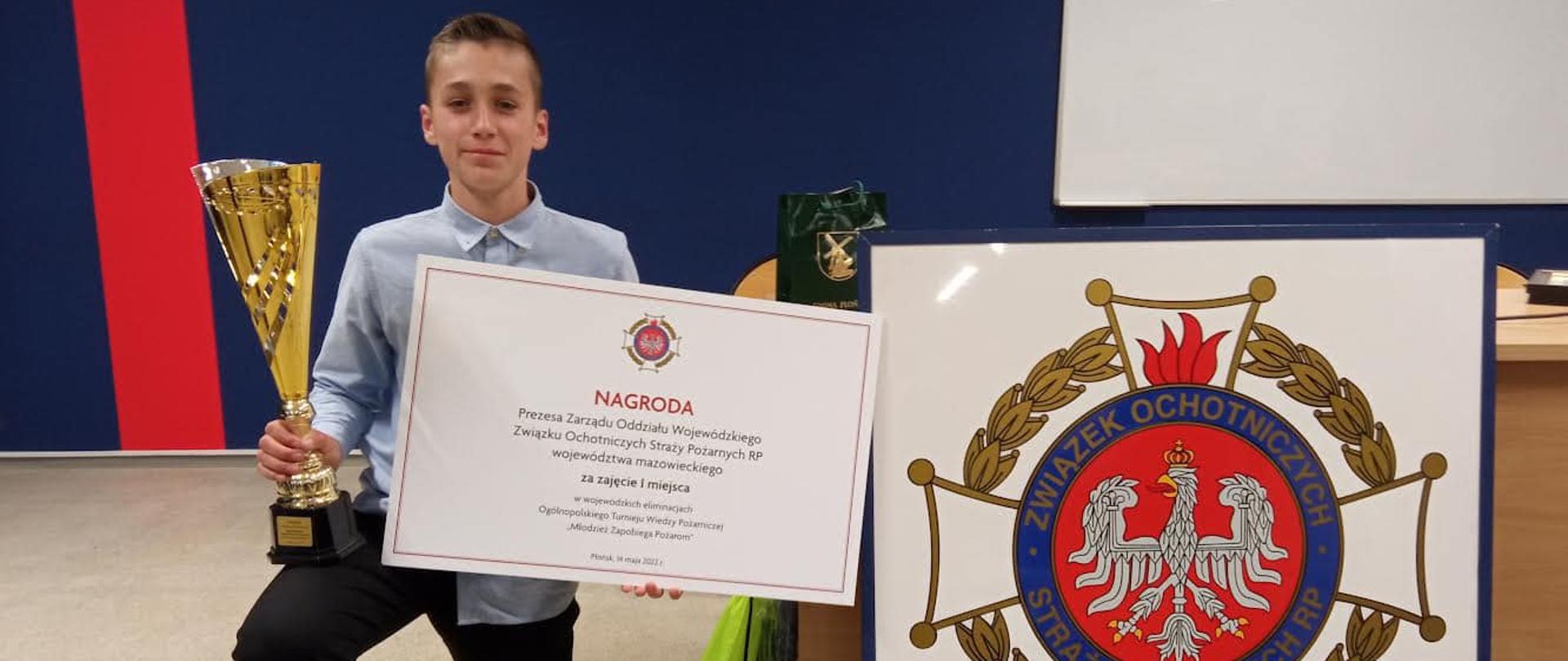 Błażej Woźniak z nagrodą za zajęcie pierwszego miejsca