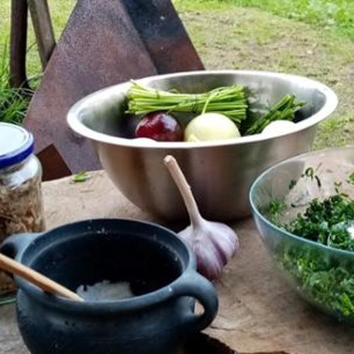 A jar and three bowls with herbs