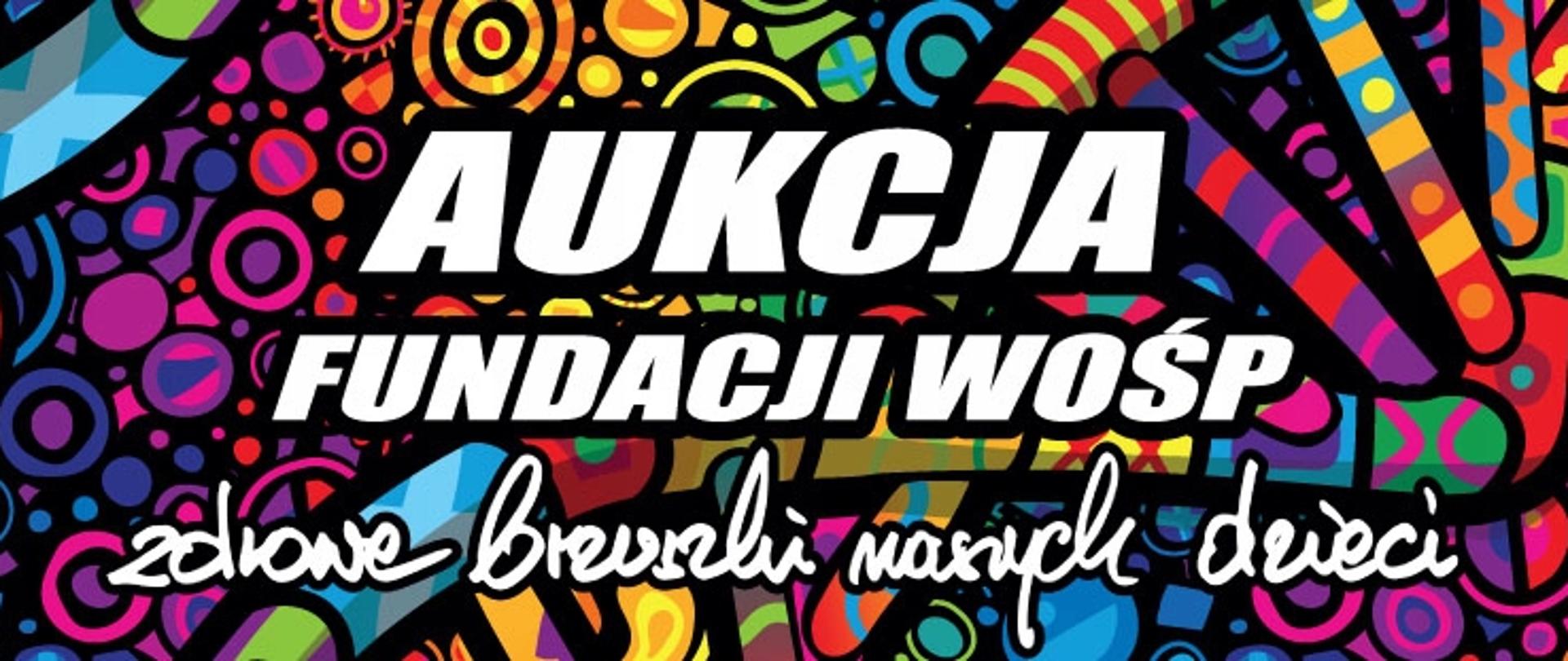 „Kolorowy baner promujący aukcje 34. Finału Wielkiej Orkiestry Świątecznej Pomocy z hasłem »Zdrowe brzuszki małych dzieci«.”