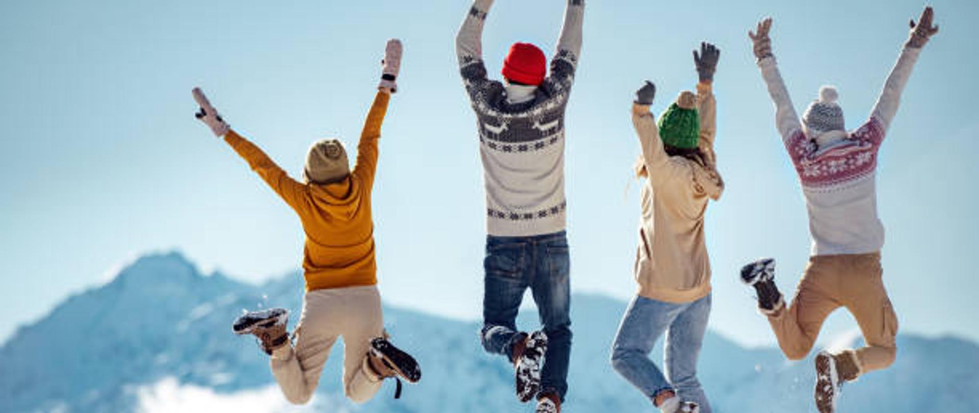Friends celebrates beginning of winter in mountains, jumps and having fun