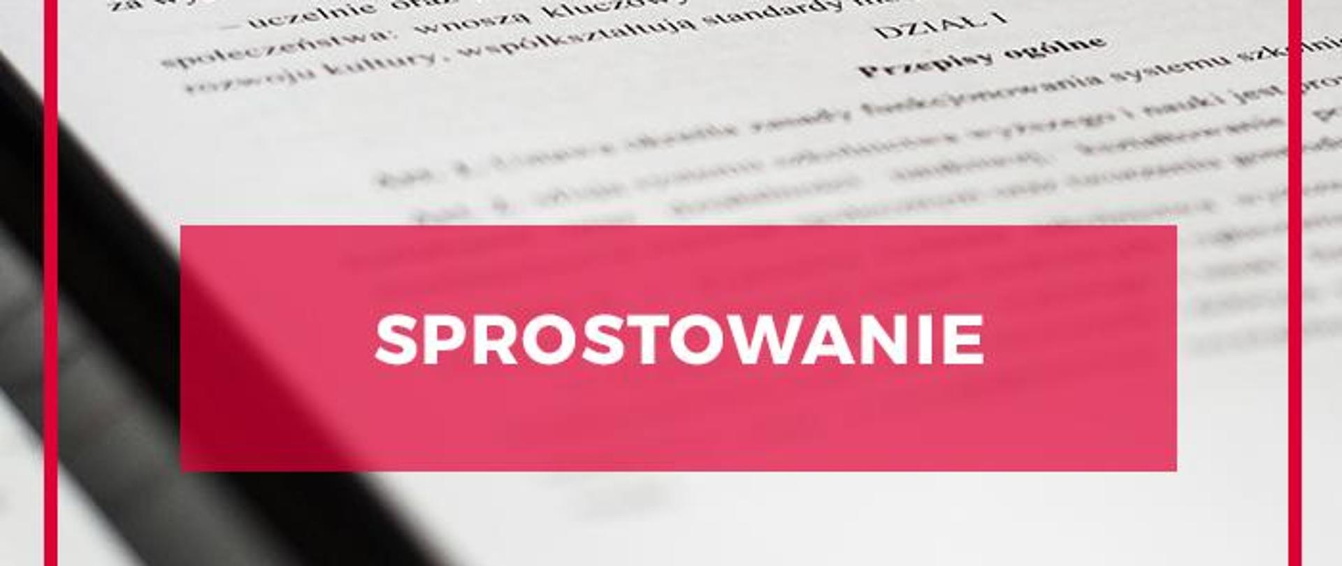 Grafika - napis sprostowanie na tle stron z treścią jakiegoś aktu prawnego