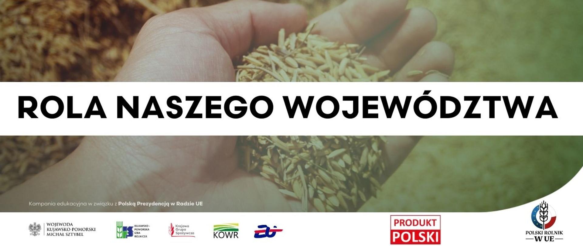 Dłoń trzymająca ziarno, na pierwszym planie napis Rola naszego województwa