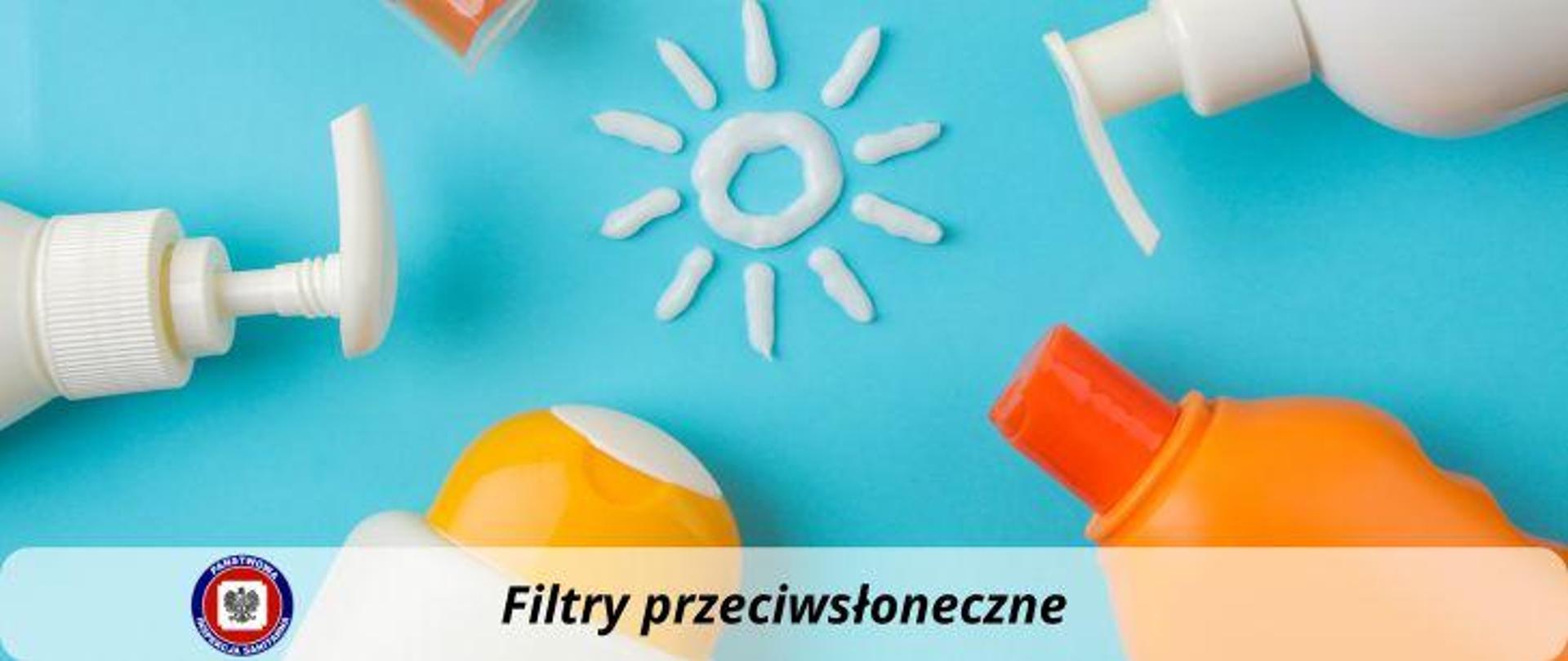 Na niebieskim tle białe i pomarańczowe opakowania produktów zawierające kremy z filtrami przeciwsłonecznymi. Na środku kształt słoneczka wykonany za pomocą białego kremu. Na dole ciemny napis Filtry przeciwsłoneczne. Po lewej stronie logo Państwowej Inspekcji Sanitarnej.