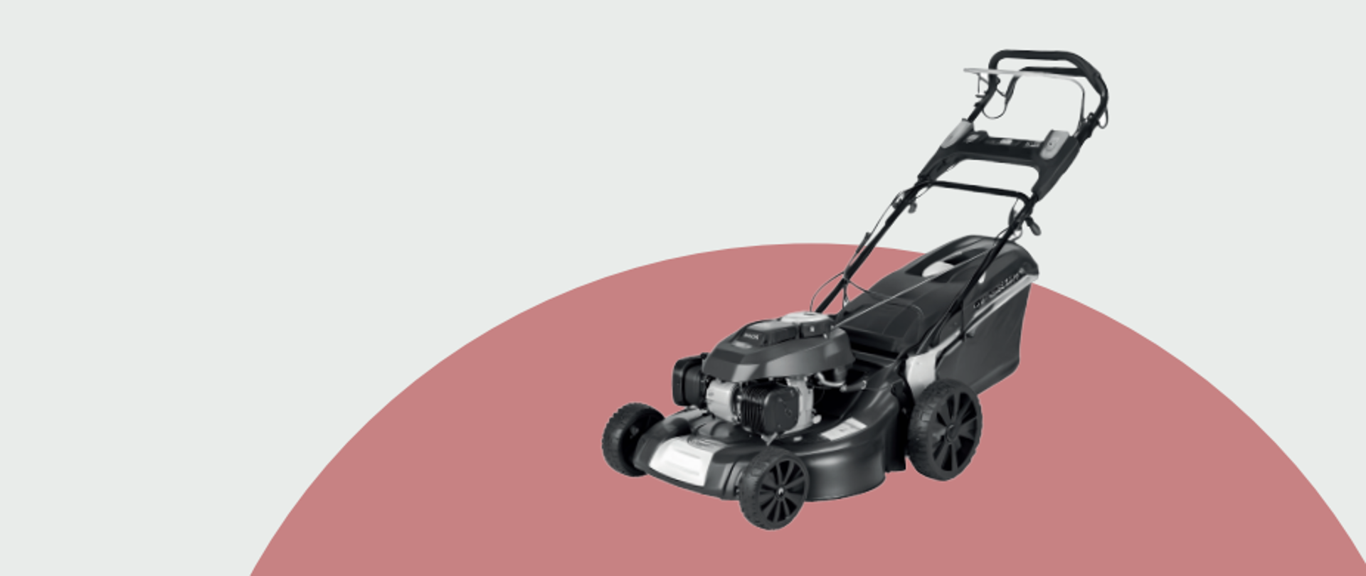 Kosiarka do trawy na różowo - szarym tle. 