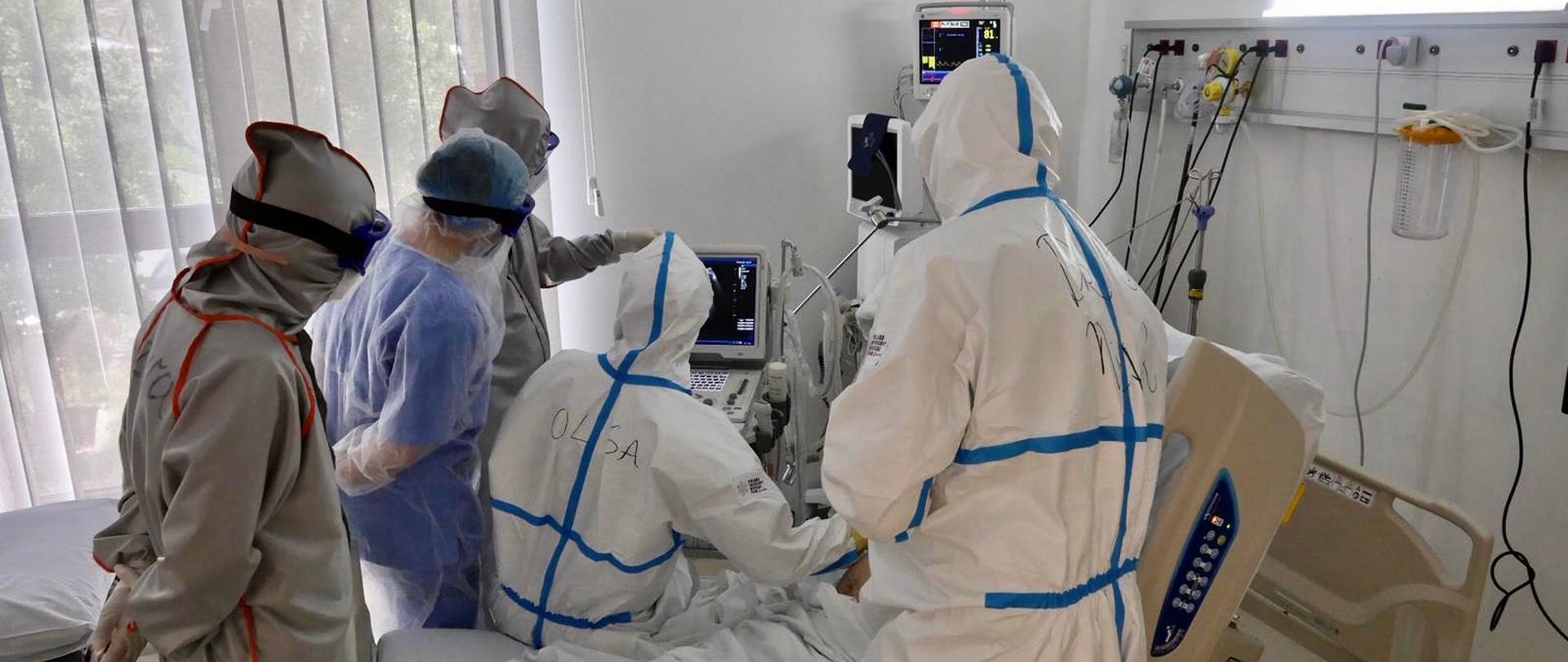 group of doctors is examining the patient