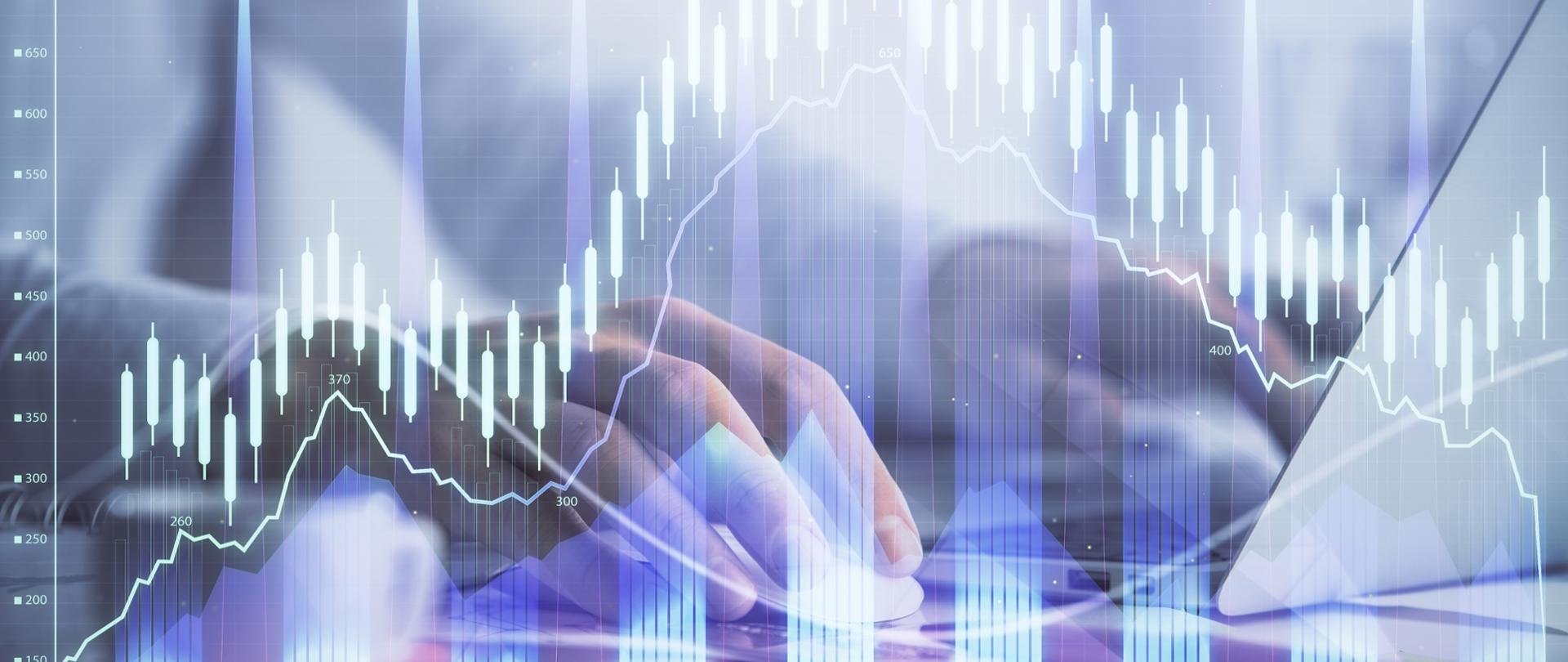 Dane statystyczne w formie słupkowej, męskie dłonie, laptop i myszka