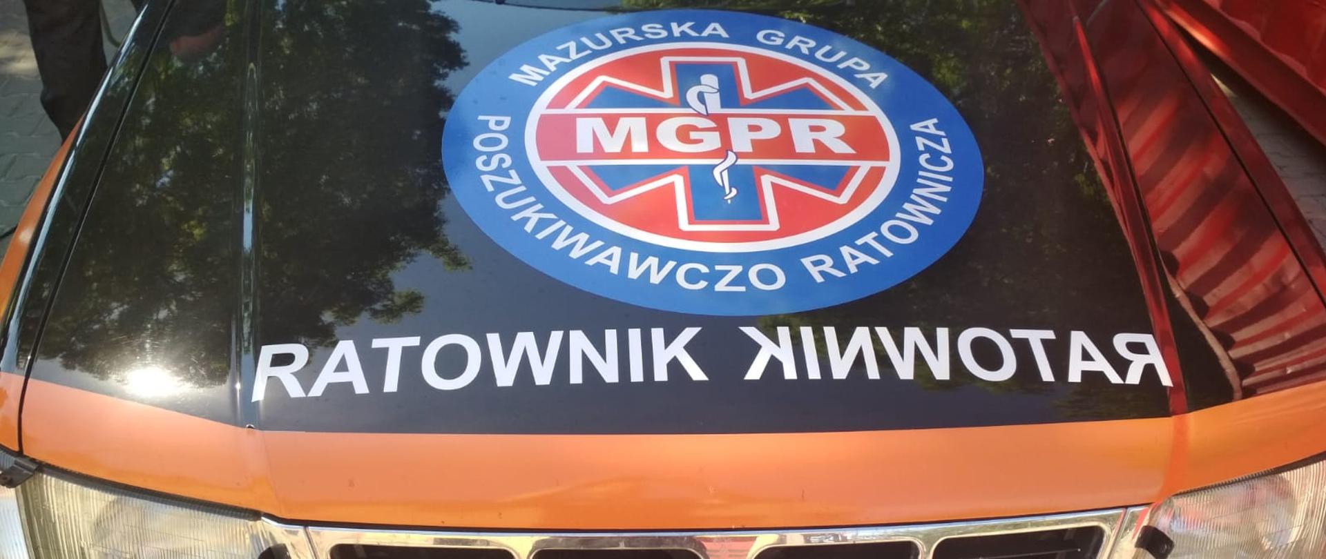 Na zdjęciu widać samochód terenowy Subaru Forester i logo MGPR na masce pojazdu