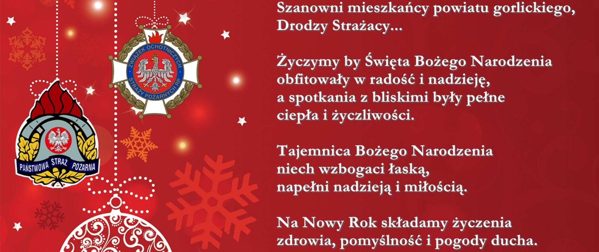 Na zdjęciu na czerwonym tle białe litery z Życzeniami Świąteczno-Noworocznymi Komendanta Powiatowego PSP w Gorlicach oraz Prezesa Zarządu Powiatowego ZOSP RP w Gorlicach. 