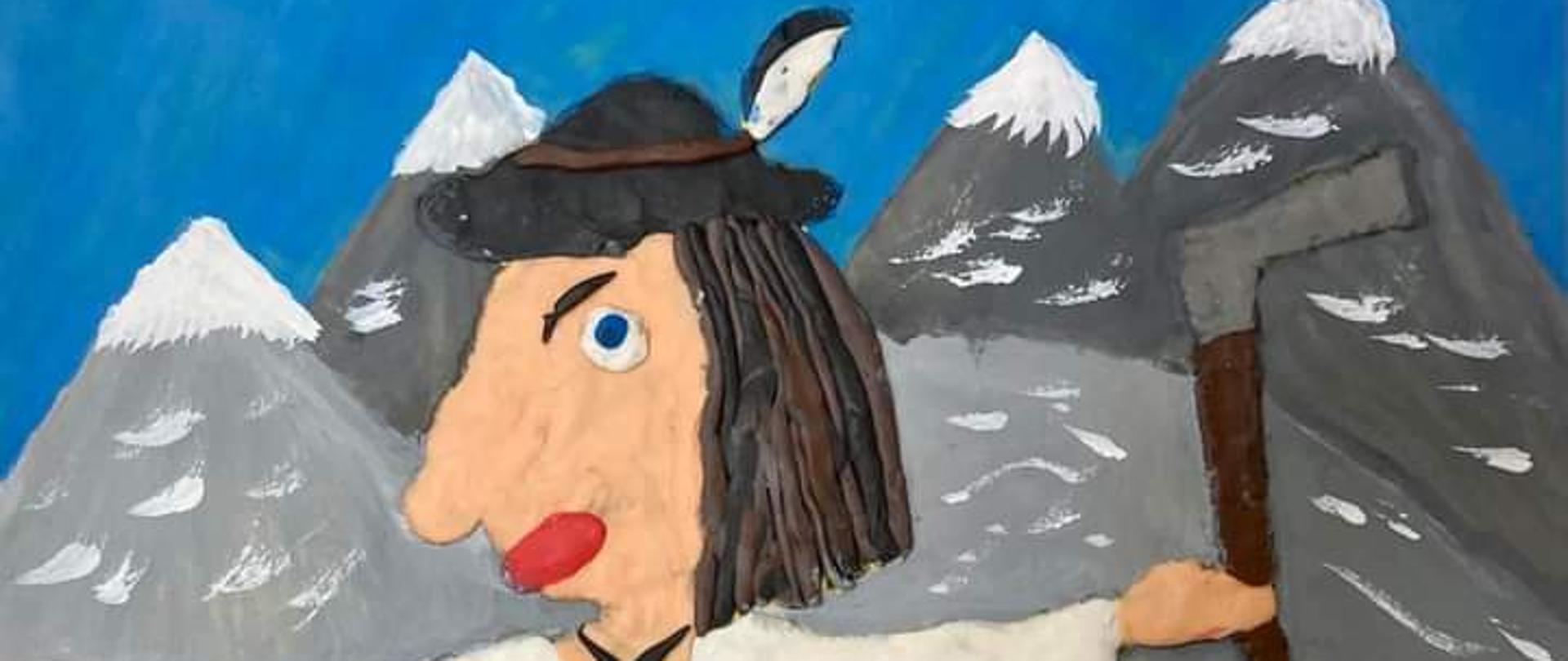 Mężczyzna w stroju góralskim stoi na hali, w tle ośnieżone góry, ubrany na biało, w ręku trzyma ciupagę.