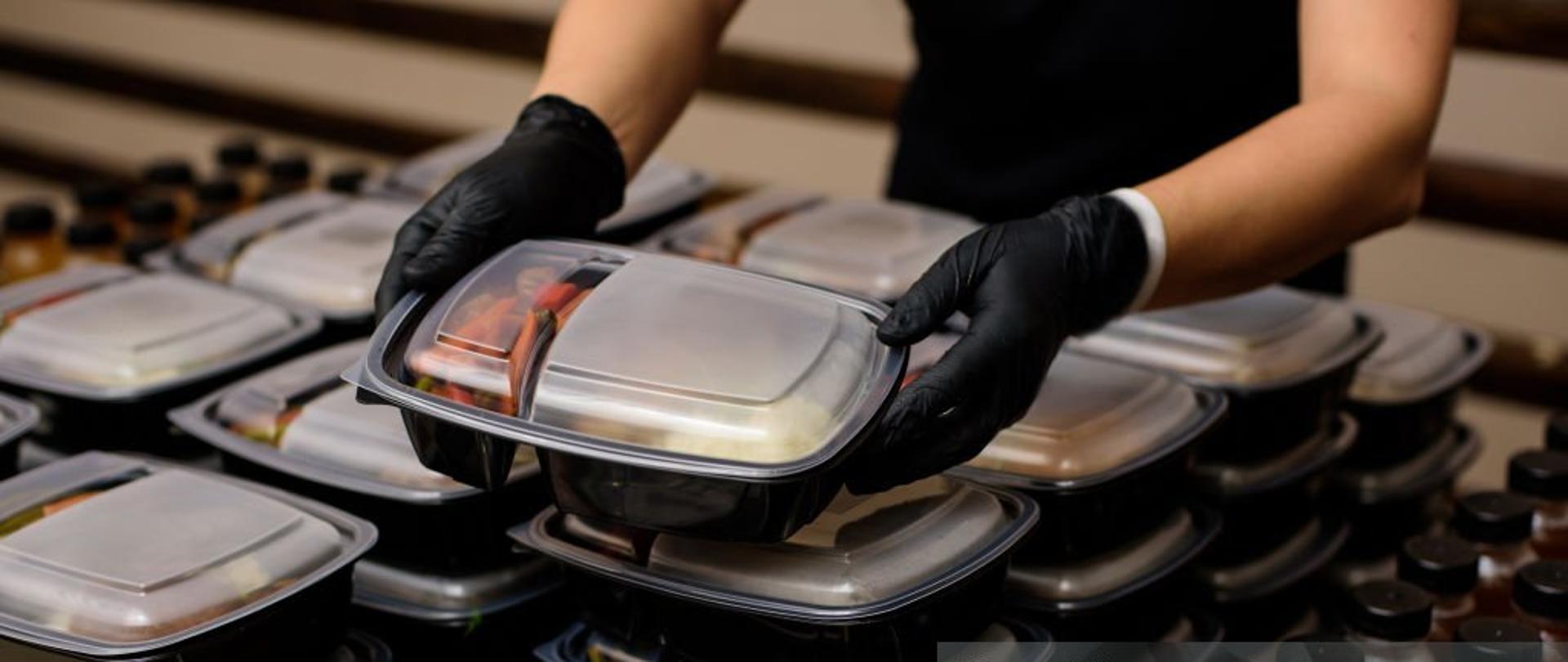 Lunch box with food in the hands. Catering