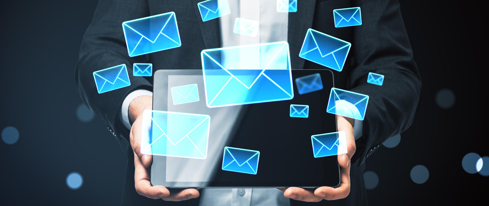 Businessperson holding tablet with glowing envelope icons, modern digital style, dark background, concept of online communication and email marketing