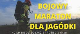 Zdjęcie przedstawia plakat informacyjny w związku z organizowanym biegiem charytatywnym dla chorej Jagódki. Na pierwszym planie strażak w pełnym umundurowaniu bojowym.